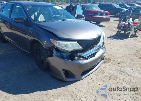 2014 Toyota Camry Hybrid Le z USA, uszkodzony, nr VIN 4T1BD1FK9EU102193